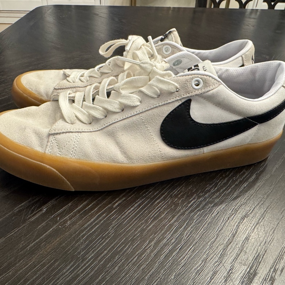 Nike White Sneakers with Black Swoosh and Brown Sole